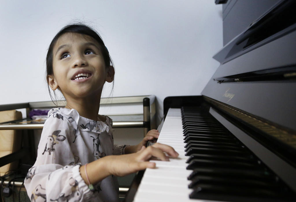 Anisah, the blind keyboard player who brings joy and laughter to her family