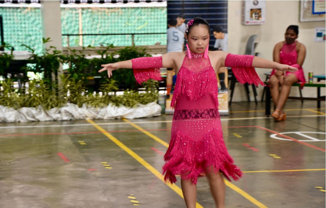 Photo shows Megan Tang, one of the Goh Chok Tong Enable Awards (UBS Promise) awardees dancing.