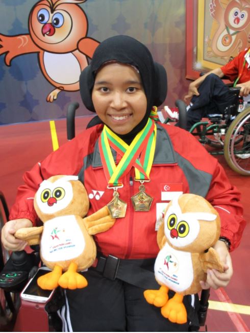 Photo shows Nurulasyiqah Mohammad Taha, one of the Goh Chok Tong Enable Awards (UBS Promise) awardees sitting on a wheelchair