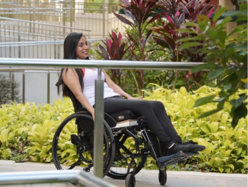 Photo shows Fathima Zohra on a wheelchair using the ramps
