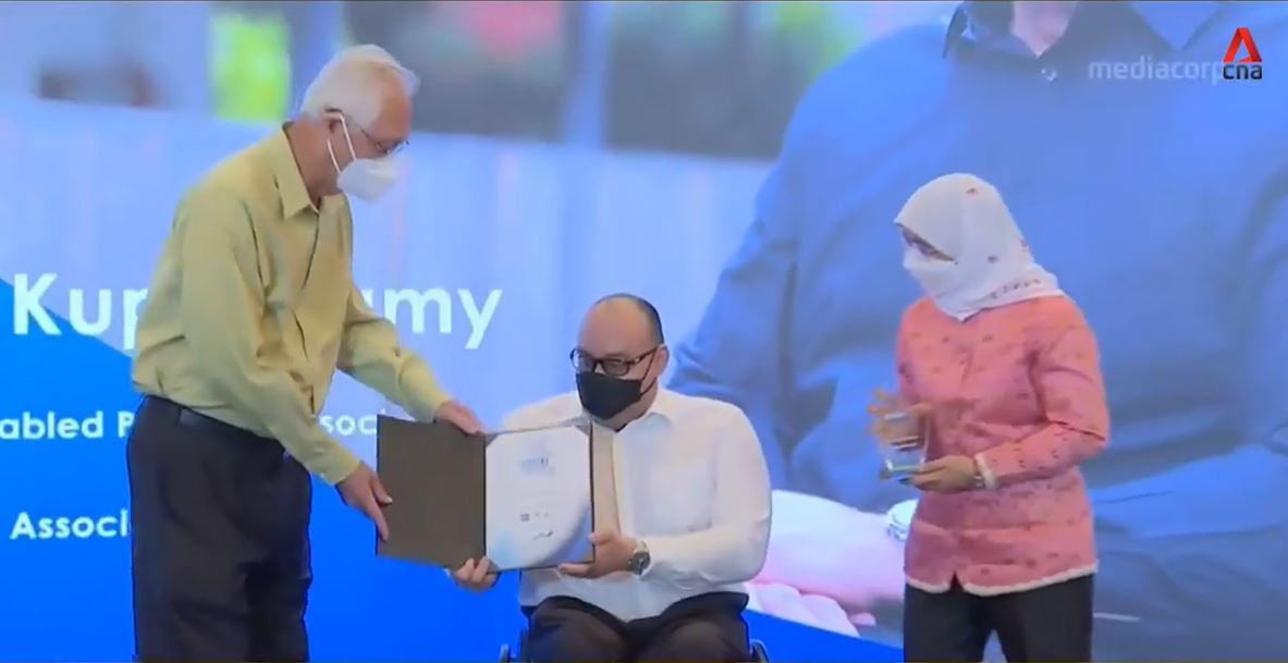 Photo shows ESM Goh Chok Tong presenting a trophy to awardee Mr Richard Kuppusamy and President Halimah Yacob holding a trophy to be presented.